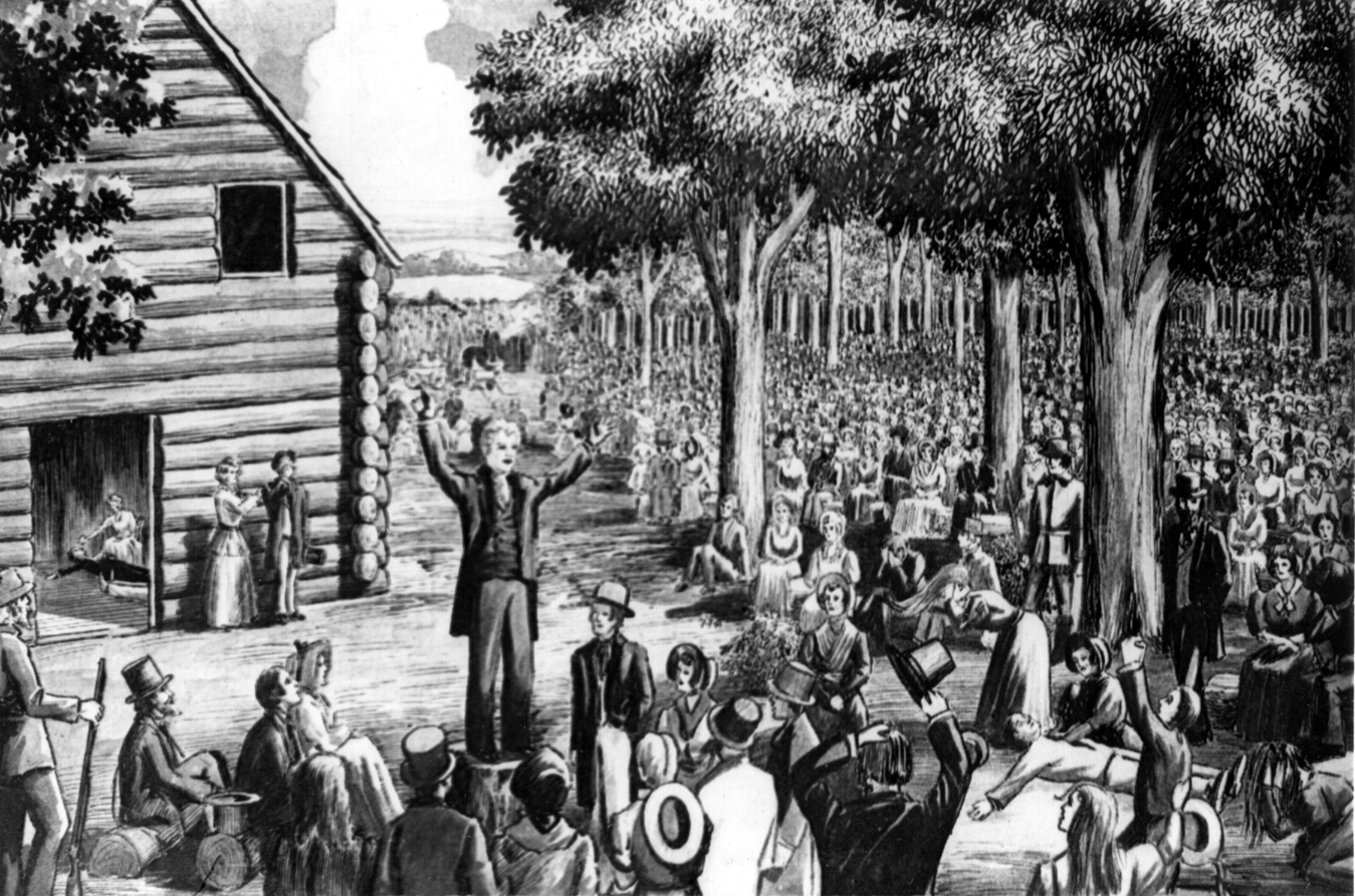 An artist’s depiction of the Cane Ridge Revival: a preacher standing on a stump beside the log meeting house, addressing an enormous crowd gathered under trees.